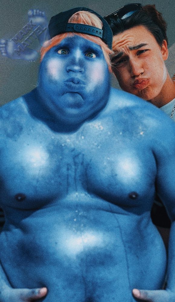 Photo of a handsome dude recently turned into a blueberry holding his belly and with big puffy inflated cheeks next to His friend who Is doing the same expression as him.