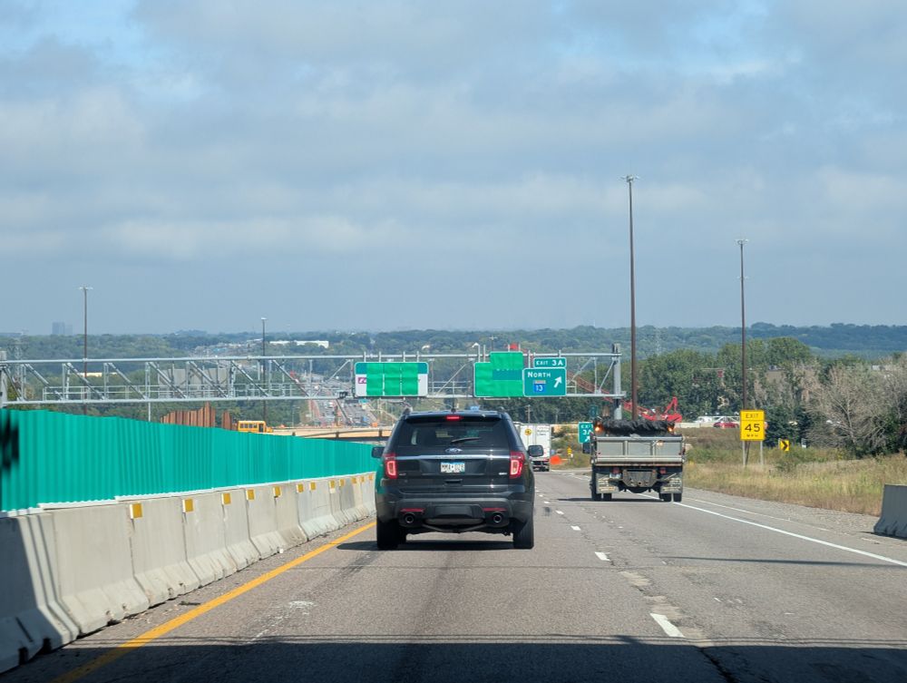 photo taken from 35W North at highway 13 looking North Alberta, Minnesota River valley towards Minneapolis. Sunny in the foreground clouded in the distance.