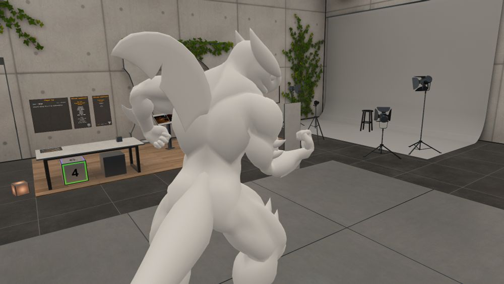 An untextured humanoid Garchomp 3D model posing and flexing in a empty lighting studio.