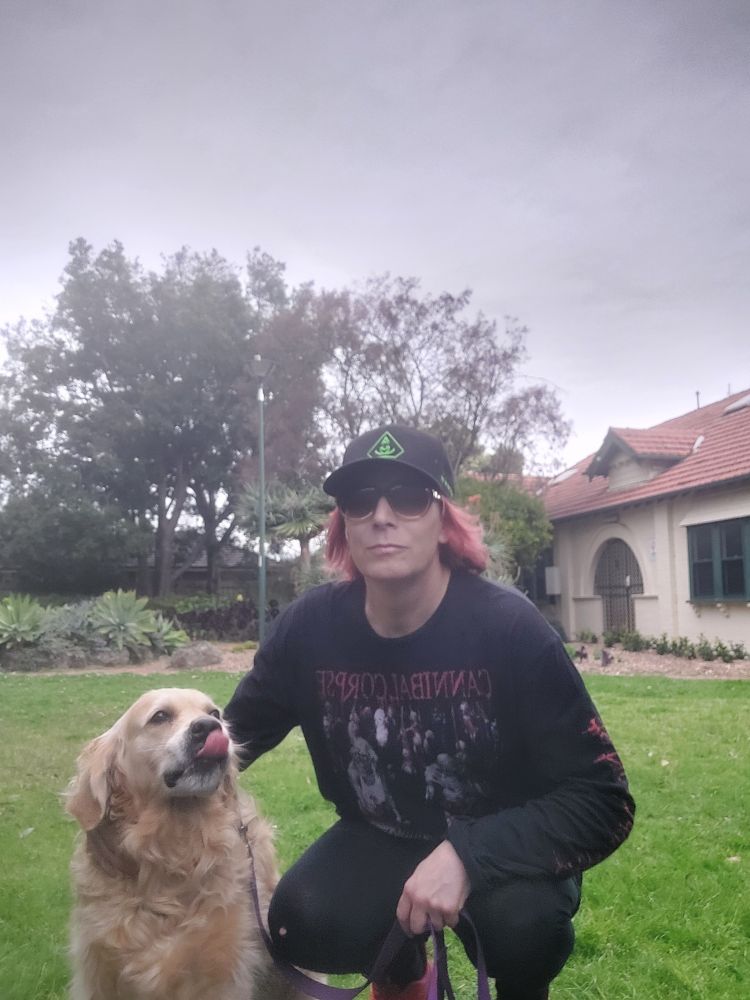 A golden retriever named Indiana Bones poses with her human, a slightly shambolic Sera Frenzy. 