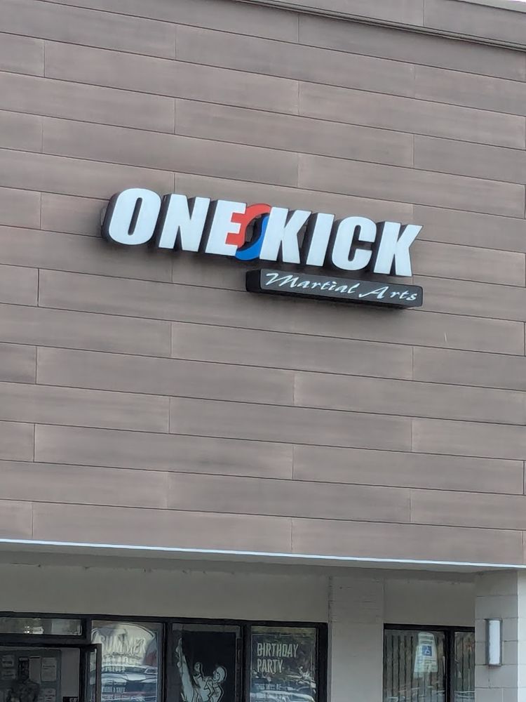 A storefront for a gym called One Kick Martial Arts
