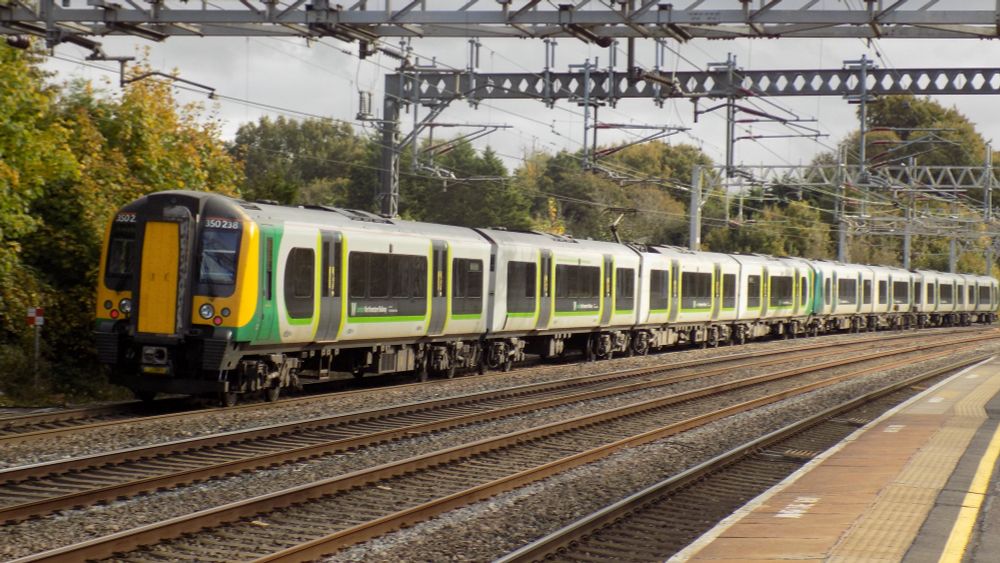 An 8 Car 350/2 service, 350 234 leading in LNWR colours but LM design, and 350 238 trailing in LM colours and Design on the slow line at Rugeley Trent Valley.