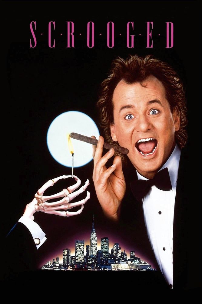 Against a black background is a man in a tuxedo, he is open mouth smiling while holding a cigar. To the left is a skeleton arm in a tuxedo coming into frame with a lit match in its fingers, lighting the cigar. Directly behind the cigar is a bright full moon and at the bottom is a cityscape of New York City. At the top in pink is the movie’s title “Scrooged”, between each letter is a pink dot. 