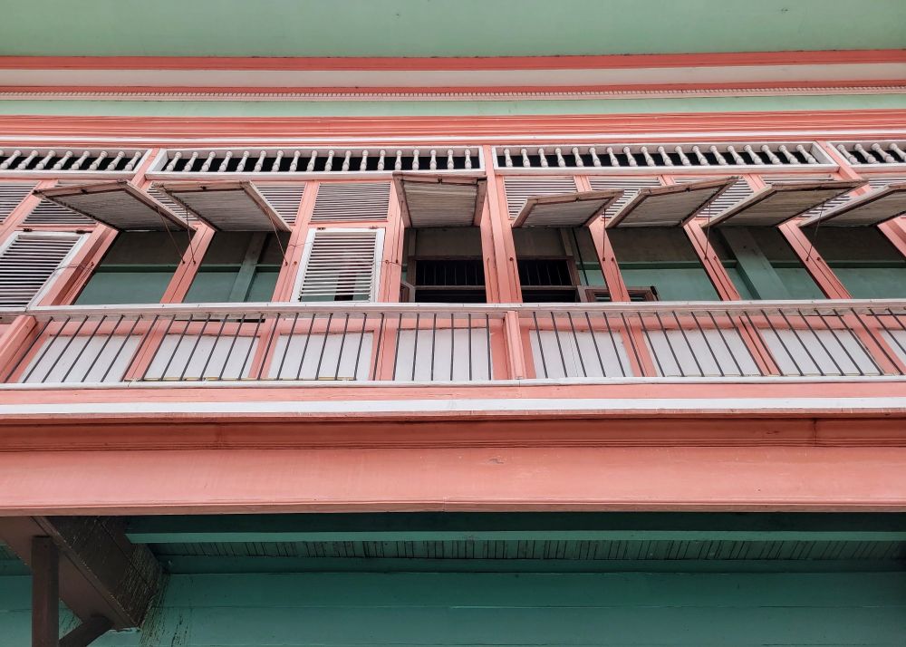 A colonial era balcony with louvered shutters adorns a home in old town Guayaquil, Ecuador. 
