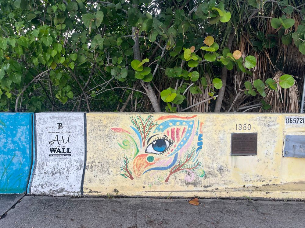 Art Wall over bridge yellow background multi colored bird 