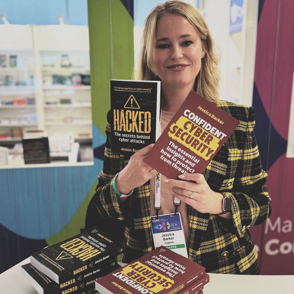 Jessica Barker singing her books at RSAC including 'Confident Cyber Security'