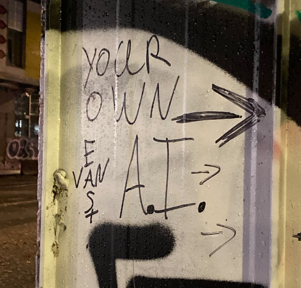 Alley graffiti: EAST VAN, YOUR OWN A.I.