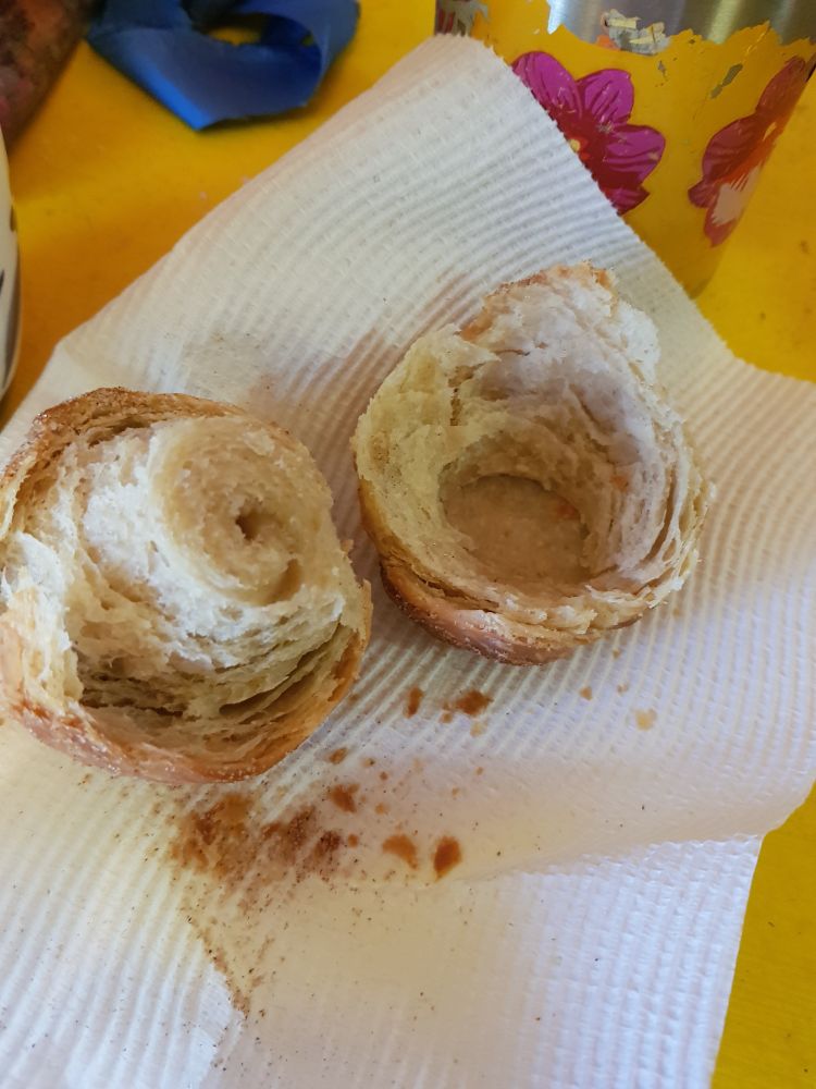 The pastry broken open showing the coils in the dough. 