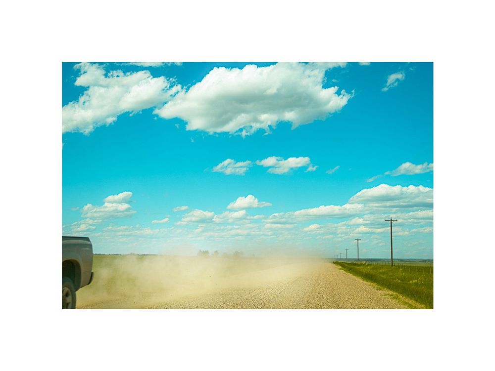 on the road of endless land and big blue sky in Alberta Single image by hedy bach