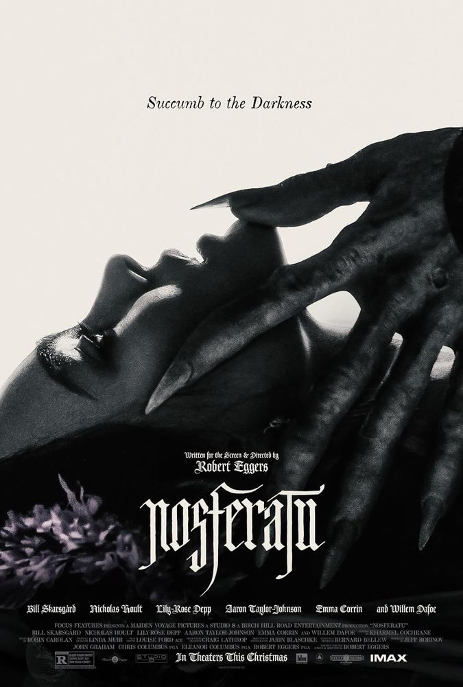 Movie poster for Nosferatu; a young woman with dark hair is laying down with the long hand of a creature on top of her. Tagline reads “succumb to the darkness”. 