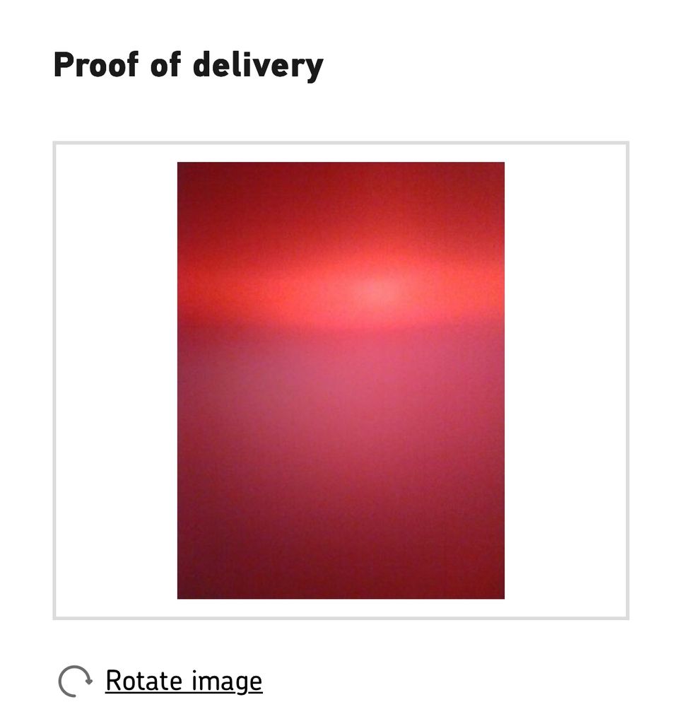 A photo of just red shades with a lighter bit in the middle that could be a hazy Martian sun.