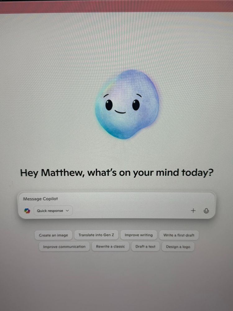 A screenshot of the Microsoft copilot website with an amorphous blue blob smiling above the search bar 