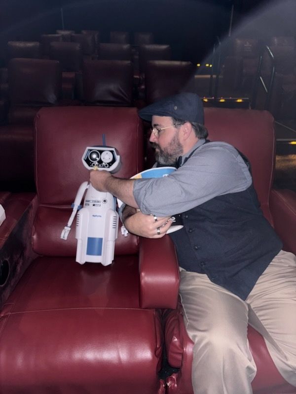 Feeding my new friend at the movies.