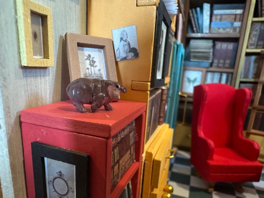 Further zoomed in we see a very tiny model of Moo Deng the hippo. 