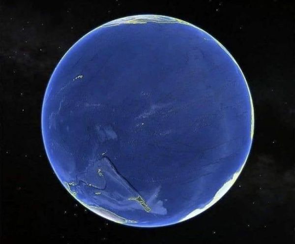 A picture of the earth showing the pacific ocean. You can see hawaii and New Zealand. Also the edge of antarctica, australia, and north and south america...but barely. 