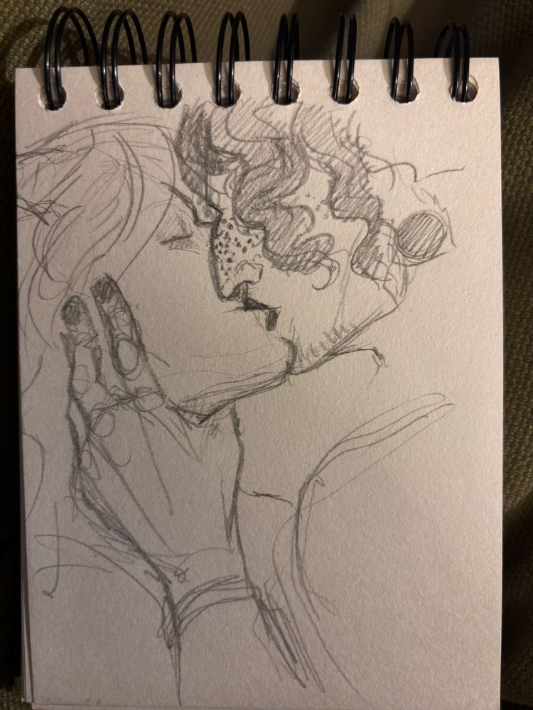 A pencil doodle of two men kissing; the one with dark curls is clutch the throat of the other.