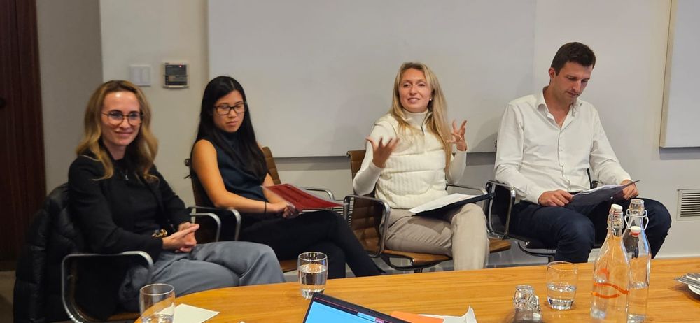 A panel of speakers at an event.