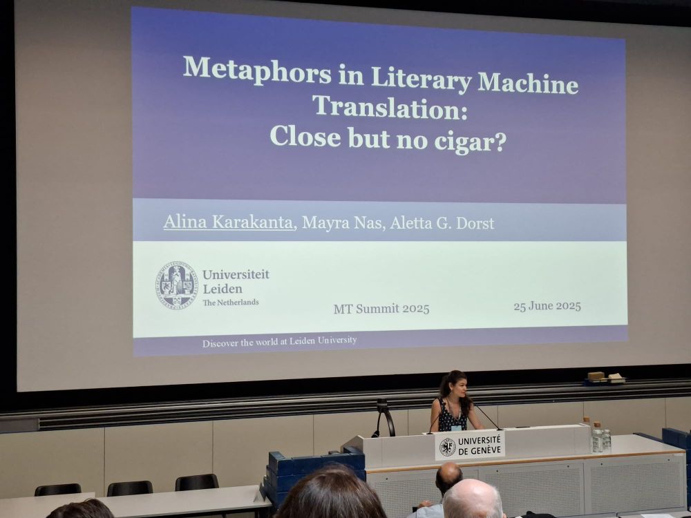 Alina Karakanta on a podium of Geneva university presenting a blue-white slide with the title “Metaphors in Literary machine translation: Close but no cigar?”