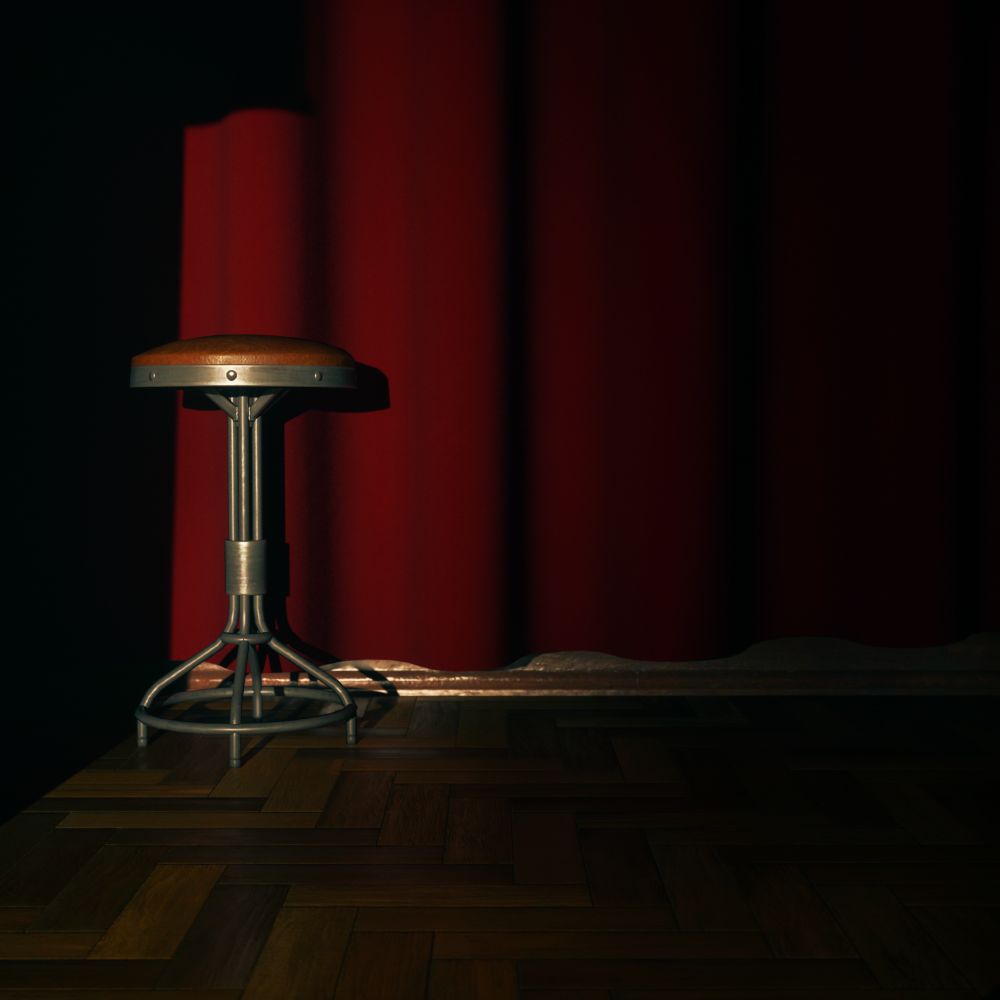 Virtual photography capture from Alan Wake 2. A short stool sits on a Parkay floor in front of a red velvet curtain.