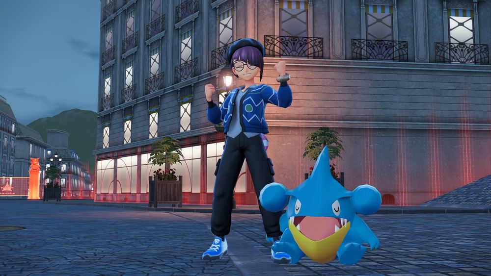 Picture of trainer Senn posing with a sleeping shiny Gible!