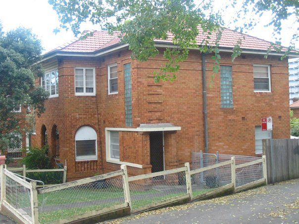 St Philips Housing Estate (circa 1940), Glebe. Double storey apartment on Broughton St with decorative glass tile.