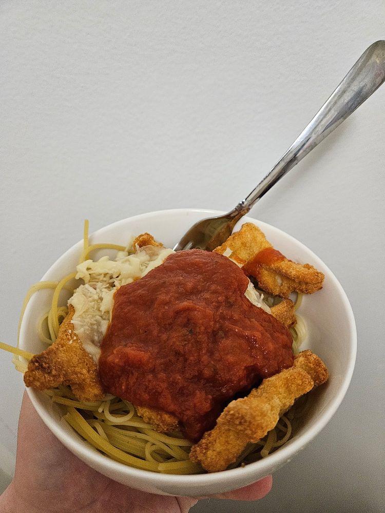 Chicken parmesan but the chicken is dinosaur chicken nuggets.