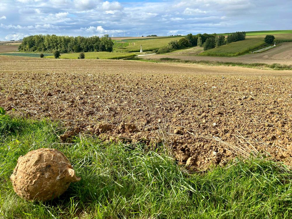 The view across a ploughed field towards the Commonwealth War Graves Commission cemetery, Beaumont-Hamel British Cemetery and the Sunken Lane. A mine was exploded on 1st July 1916 from near where the picture was taken, signalling the opening of the Allied attacks on German positions in the Battle of the Somme. The British Army suffered almost 60,000 casualties that day, the bloodiest day in its history.