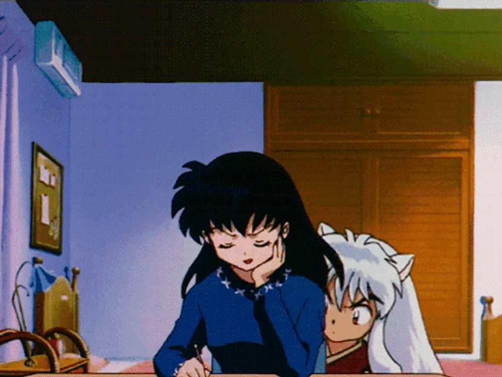 a girl and a dog are sitting at a desk with their eyes closed