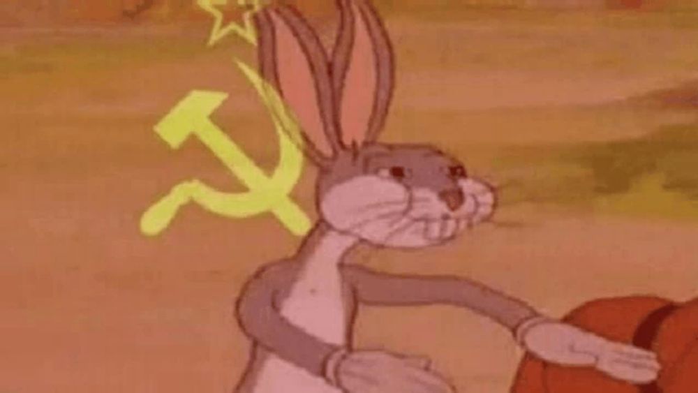 bugs bunny is wearing a hammer and sickle hat and holding a basketball in his hands .