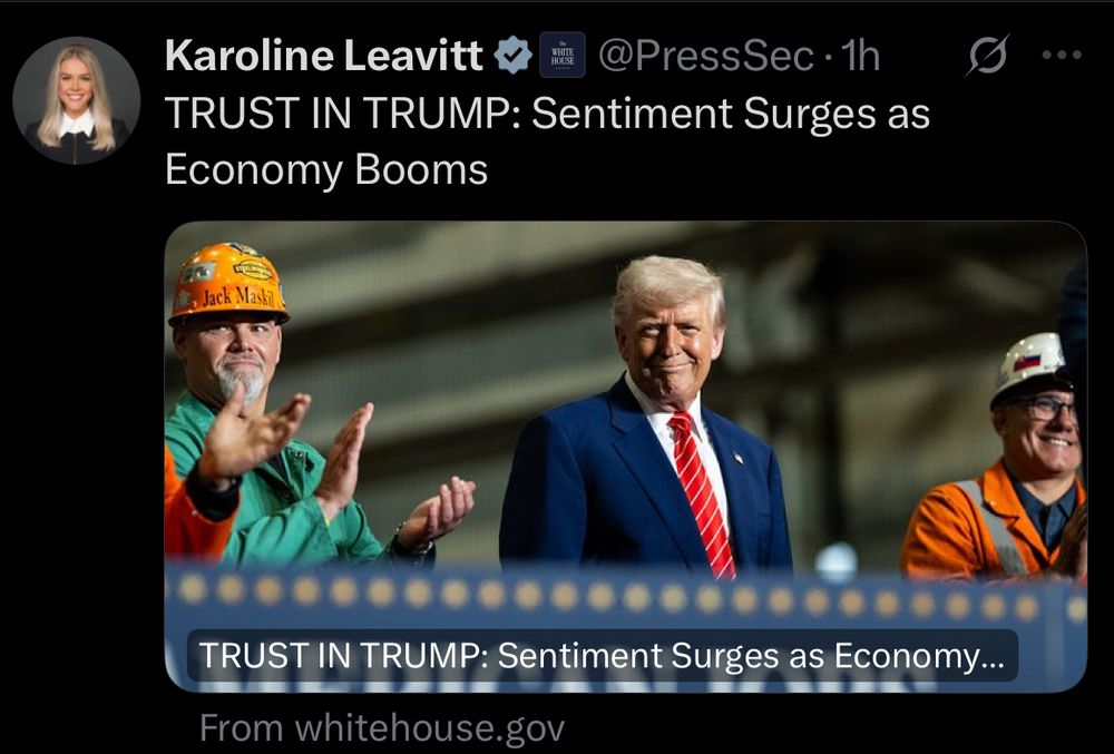 A social media post by Karoline Leavitt (@PressSec) with a headline reading “TRUST IN TRUMP: Sentiment Surges as Economy Booms.” The image shows Donald Trump smiling in a blue suit and red tie, standing between two men in construction gear applauding—one wearing a yellow hard hat labeled “Jack Maskill” and a green shirt, the other in orange safety gear. The caption below the image repeats the headline. The post includes a link indicating the source is “From whitehouse.gov.”