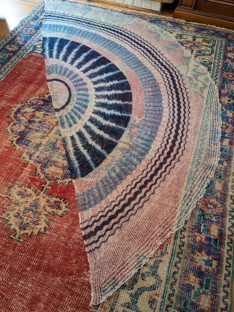 semicircular shawl in cobweb shetland lace yarn dyed with indigo in ikat patterns