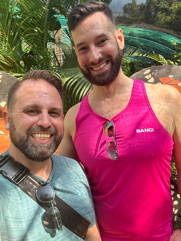 Two men, one in green and one in pink athleisure