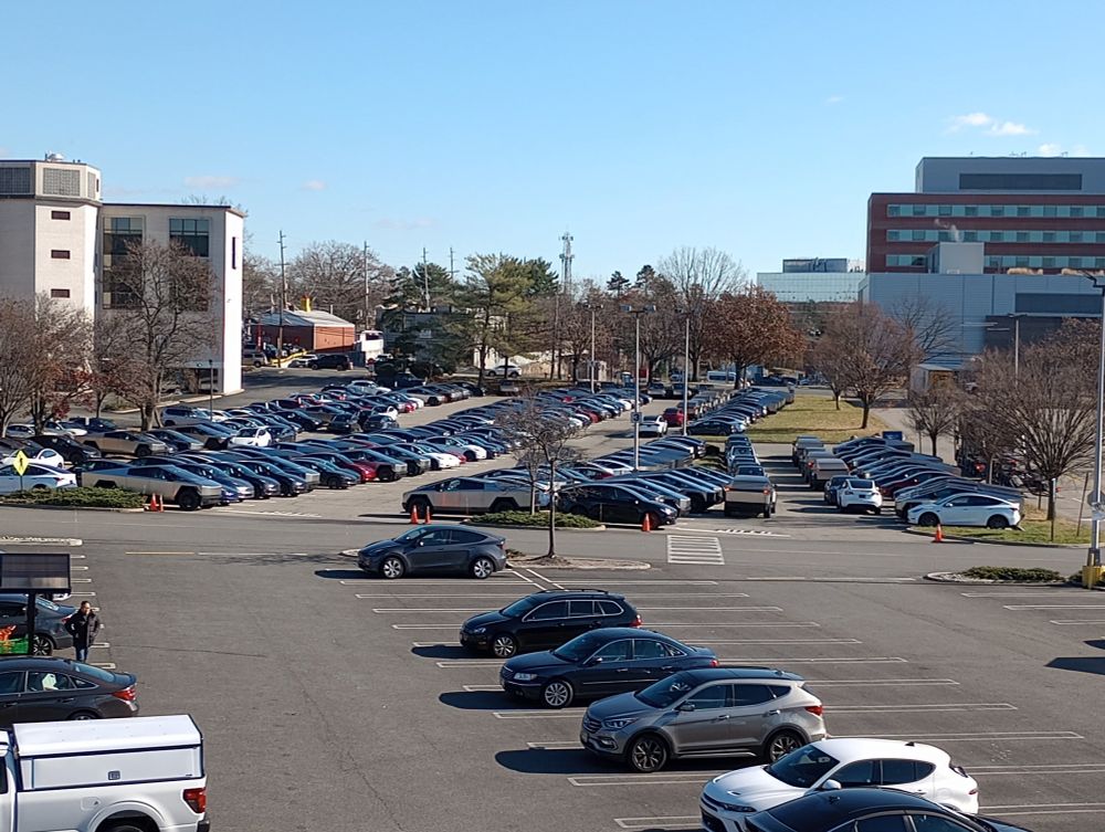 Unsold Teslas parked in lot looking unsold. Sales look to be down. 