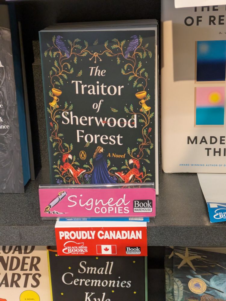 Copies of The Traitor of Sherwood Forest with a signed copies label and a proudly Canadian label.
