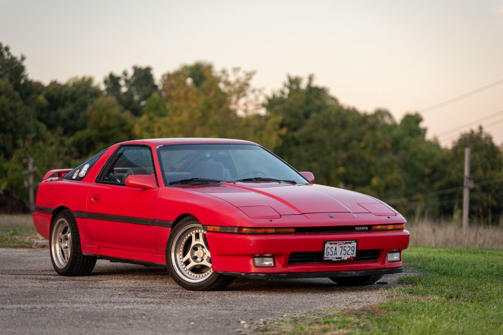 a bitchin' red 1988 Toyota Supra Turbo on Advan SA3 two-piece tri-spoke wheels