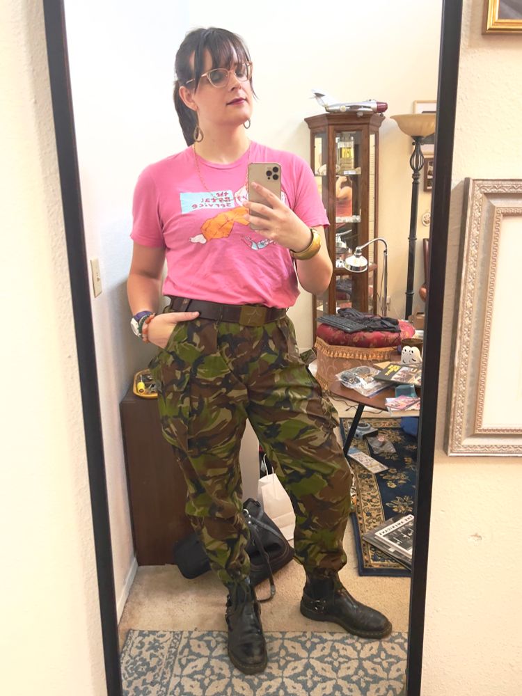 Vicki wearing DPM pants with a Postal Service tshirt 