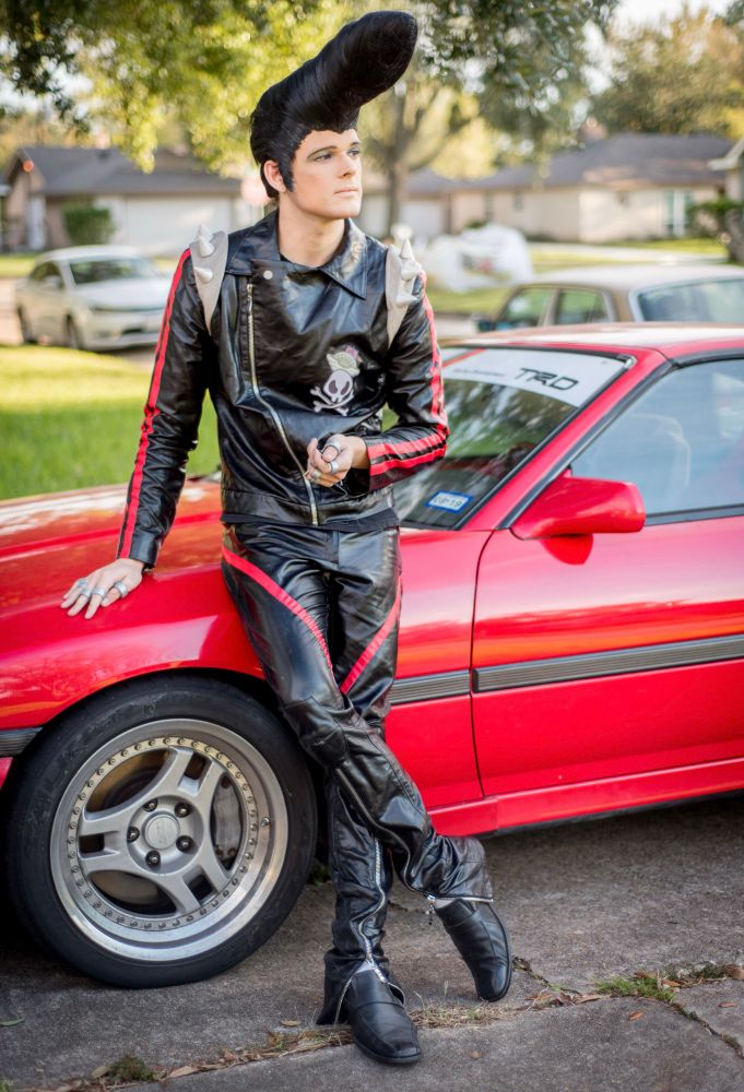 Vicki dressed as Sweet JP again, leaned up on her Supra 