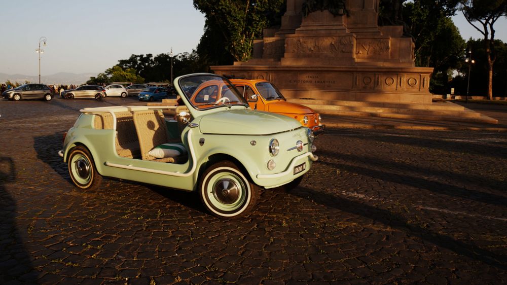 two cute fiats on the gianicolo hill at sunset (Rome, Italy)