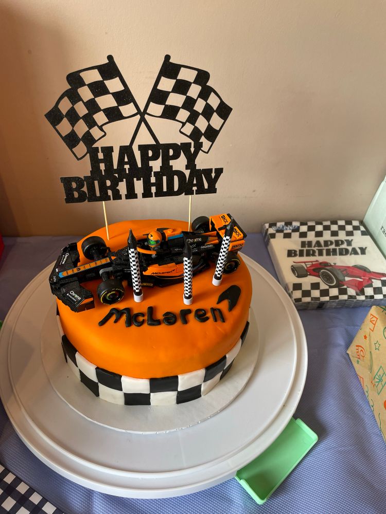 A McLaren Birthday cake with a Lego McLaren on top