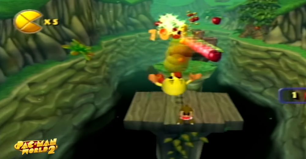 Screenshot of Pac-Man bouncing around in a forest level in Pac-Man World 2