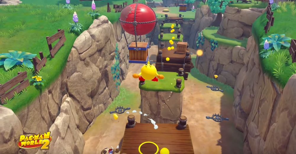 Screenshot of Pac-Man bouncing around in a forest level in Pac-Man World 2 Re-Pac