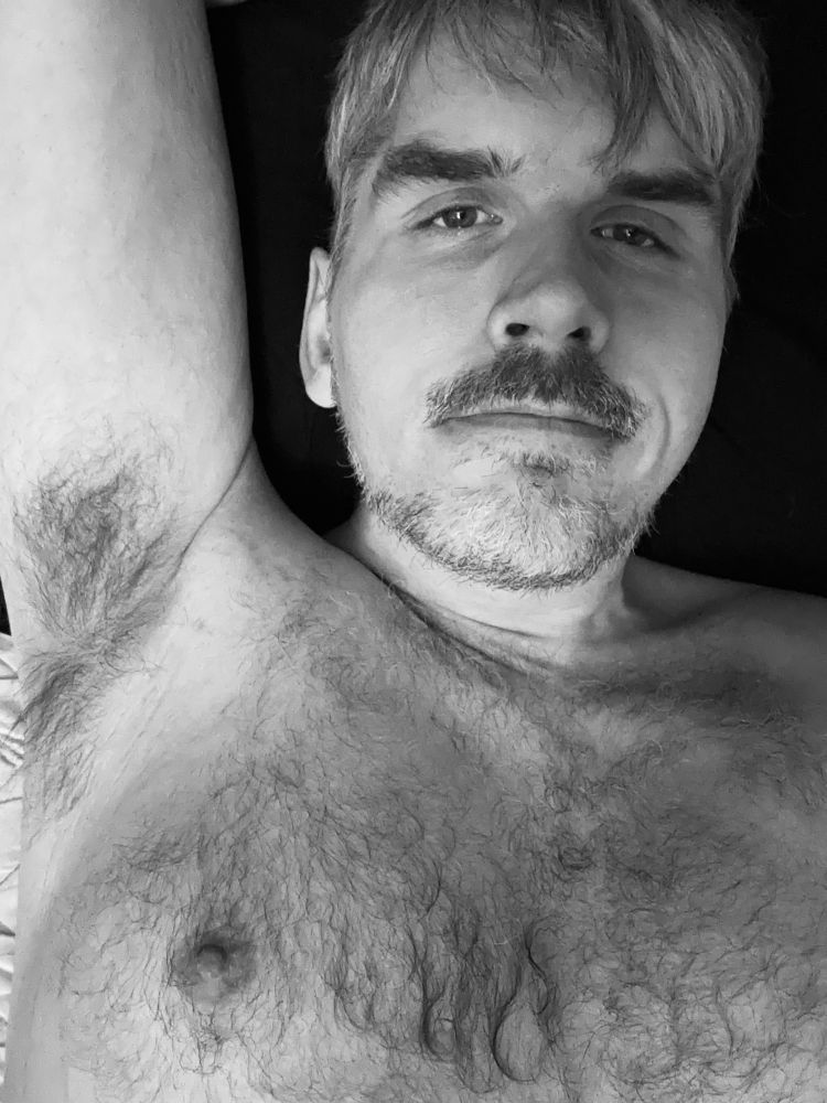 Me laying topless 