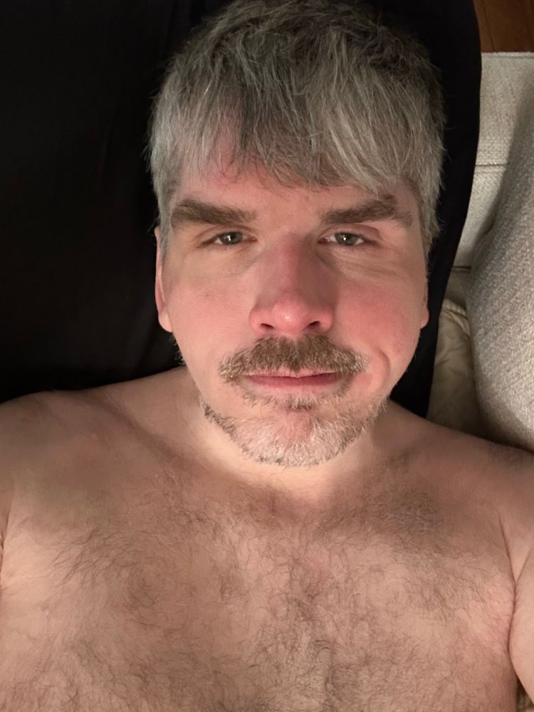 Me laying down topless 