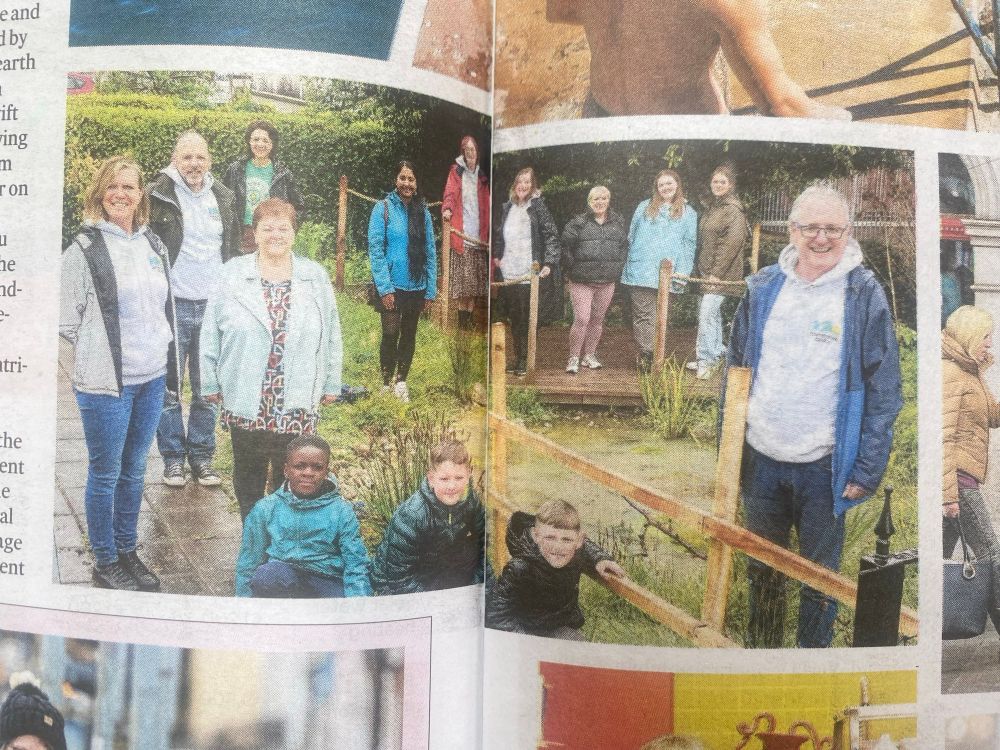 Photo of community members around the Starling Pond in Cabra. 