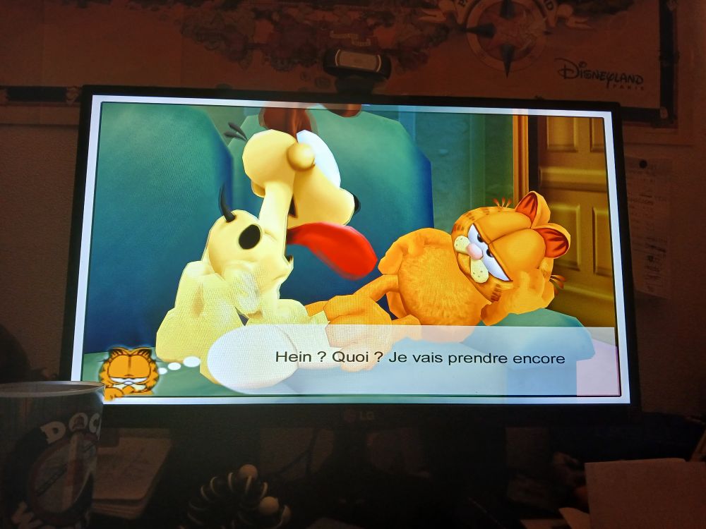 Capture écran d'un jeu Garfield.
Odie le chien est devant lui, le chat est allongé.
Garfield dit "oh non, je vais prendre encore"