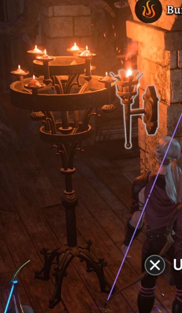Bg3 cropped screenshot. A tall candelabra placed directly in front of a torch, both lit with a warm glow