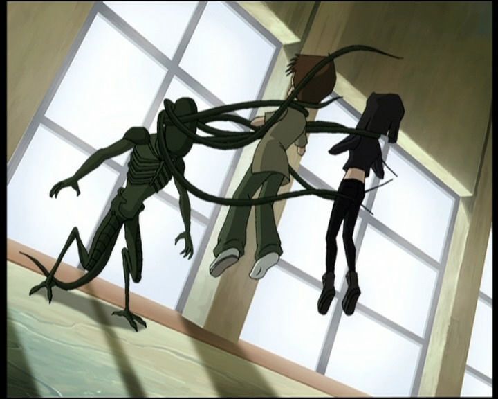 Ulrick and Yumi being attacked by a X.A.N.A. possessed movie prop resembling an alien.