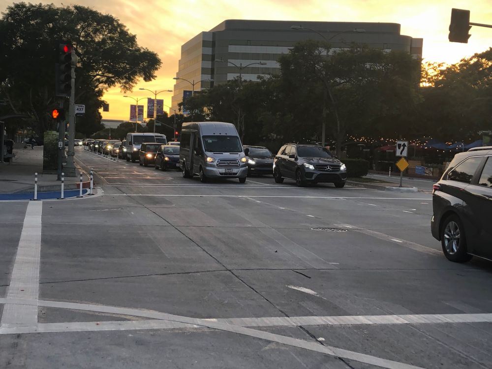 Bumper to bumper traffic, two lanes for cars and one bus lane