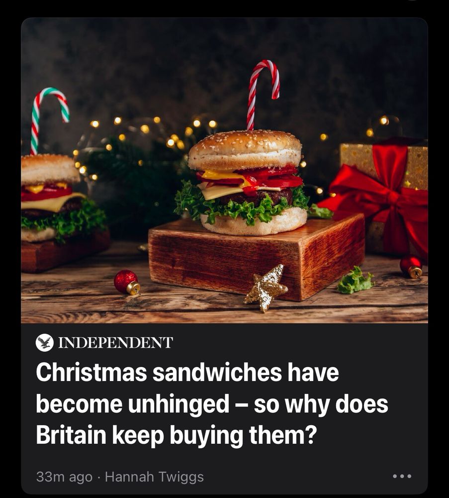News thumbnail of burgers stuck with a candy cane surrounded by Christmas decorations, presents, and fairy lights 

headline is asking ‘Christmas sandwiches have become unhinged - so why does Britain keep buying them?’