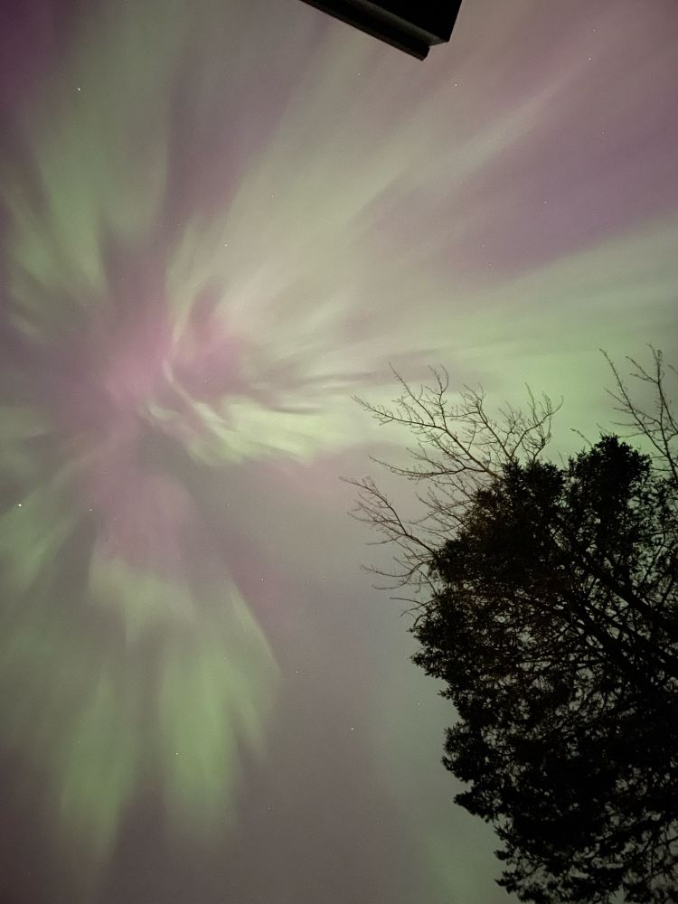 Very bright aurora in the sky overhead